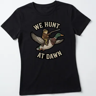 Cartoon frog riding a duck with the text 'We Hunt At Dawn' in vibrant colors — printed on a women's shirt