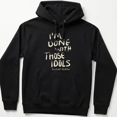 Text-based design featuring dusty bibles with the quote 'I'm Done With Those Idols Josiah Queen' — printed on a unisex hoodie