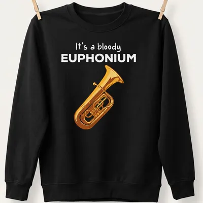 Cartoon euphonium t-shirt featuring humorous text in gold and yellow on black — printed on a unisex sweatshirt