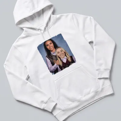 Photographic design of Paige Bueckers and Azzi Fudd playing basketball in vibrant colors — printed on a unisex hoodie