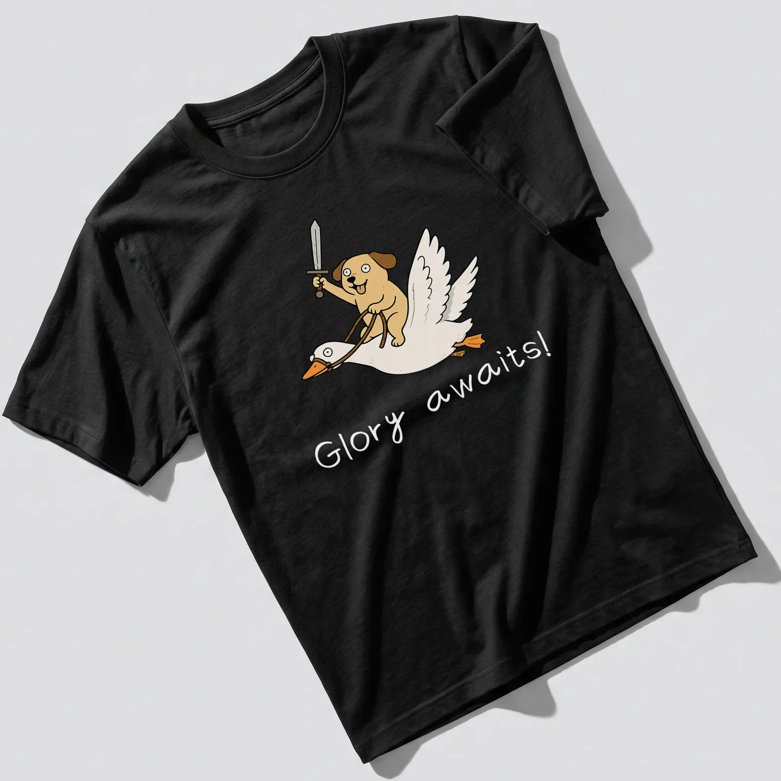 Cartoon of a dog riding a goose with the text 'Glory awaits!' — printed on a unisex t-shirt