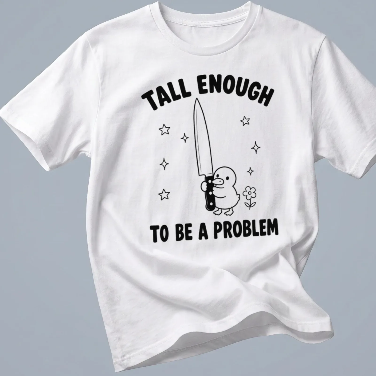 Cartoon duck holding a knife with humorous text in black and white — printed on a unisex t-shirt