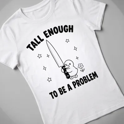 Cartoon duck holding a knife with humorous text in black and white — printed on a women's shirt