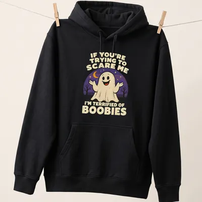 Retro tee with a funny ghost and humorous text about being scared of boobies. — printed on a unisex hoodie