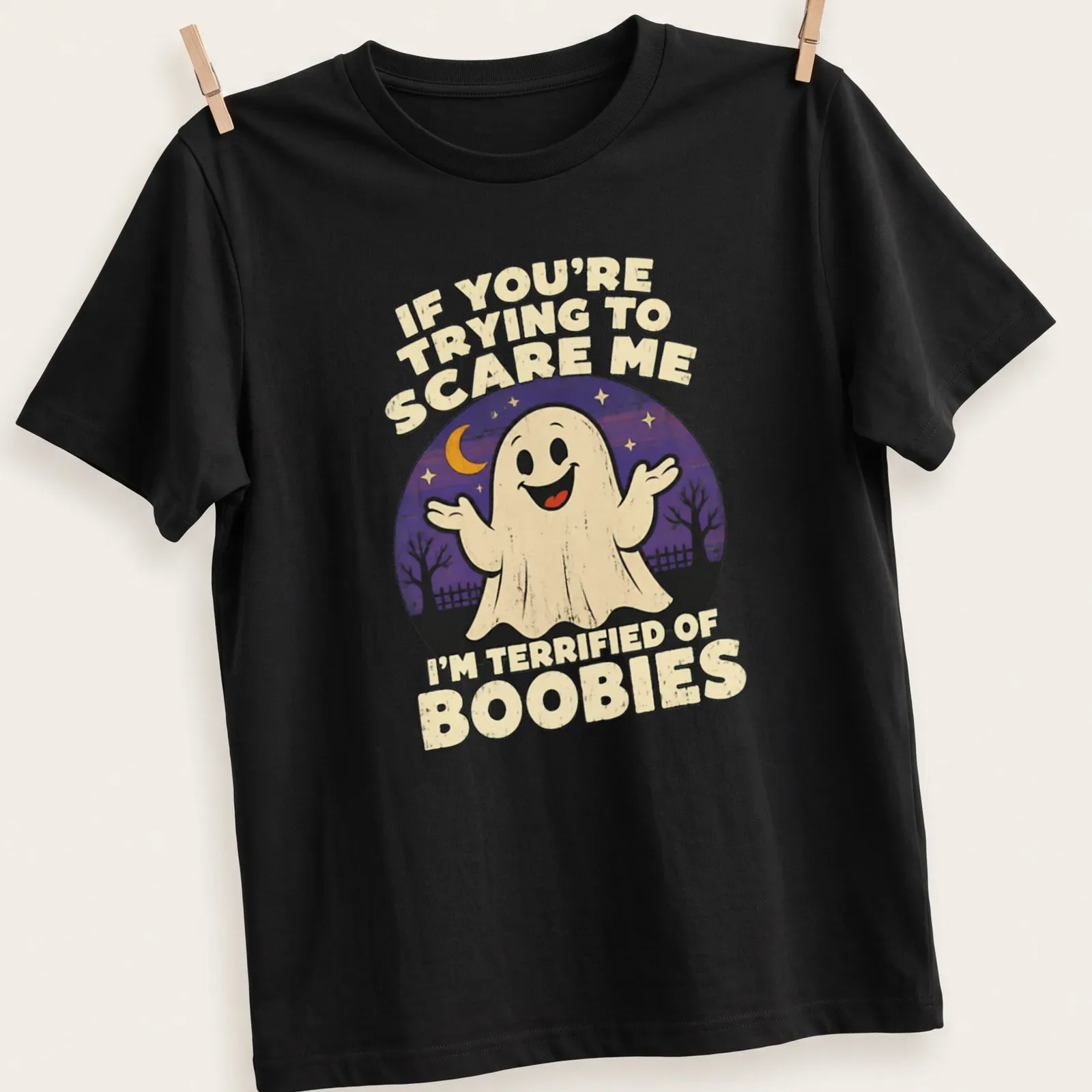 Retro tee with a funny ghost and humorous text about being scared of boobies. — printed on a unisex t-shirt