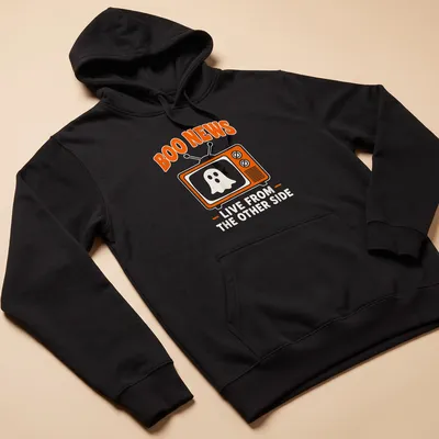 Playful cartoon ghost design with text 'Boo News Live From The Other Side' in orange and white — printed on a unisex hoodie