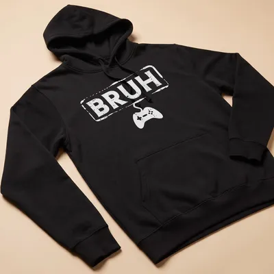 Bold typography Gamer Bruh shirt featuring a video game controller in white — printed on a unisex hoodie