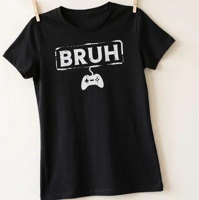 Bold typography Gamer Bruh shirt featuring a video game controller in white — printed on a women's shirt