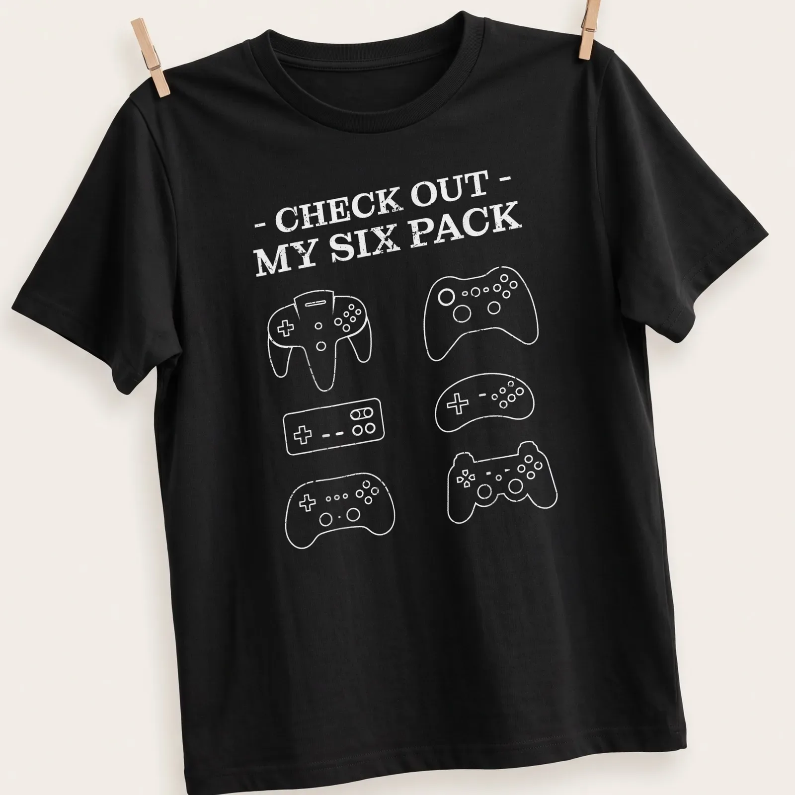Minimalist Gamer Six Pack t-shirt with game controllers and playful text — printed on a unisex t-shirt