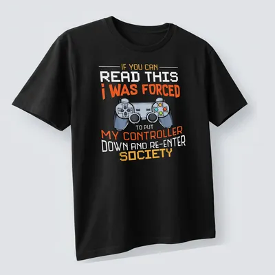 Bold graphic tee with humorous gaming quote and controller illustration — printed on a unisex t-shirt (angled view)