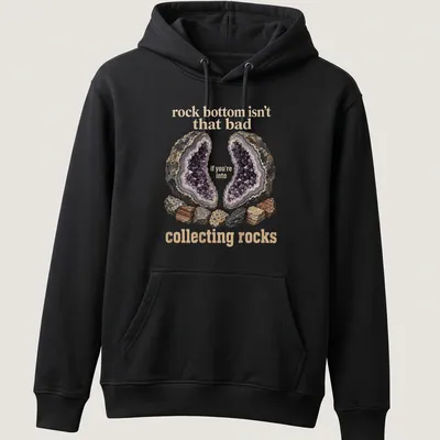 Illustrative design featuring various rocks and a geode with a humorous quote about collecting rocks. — printed on a unisex hoodie