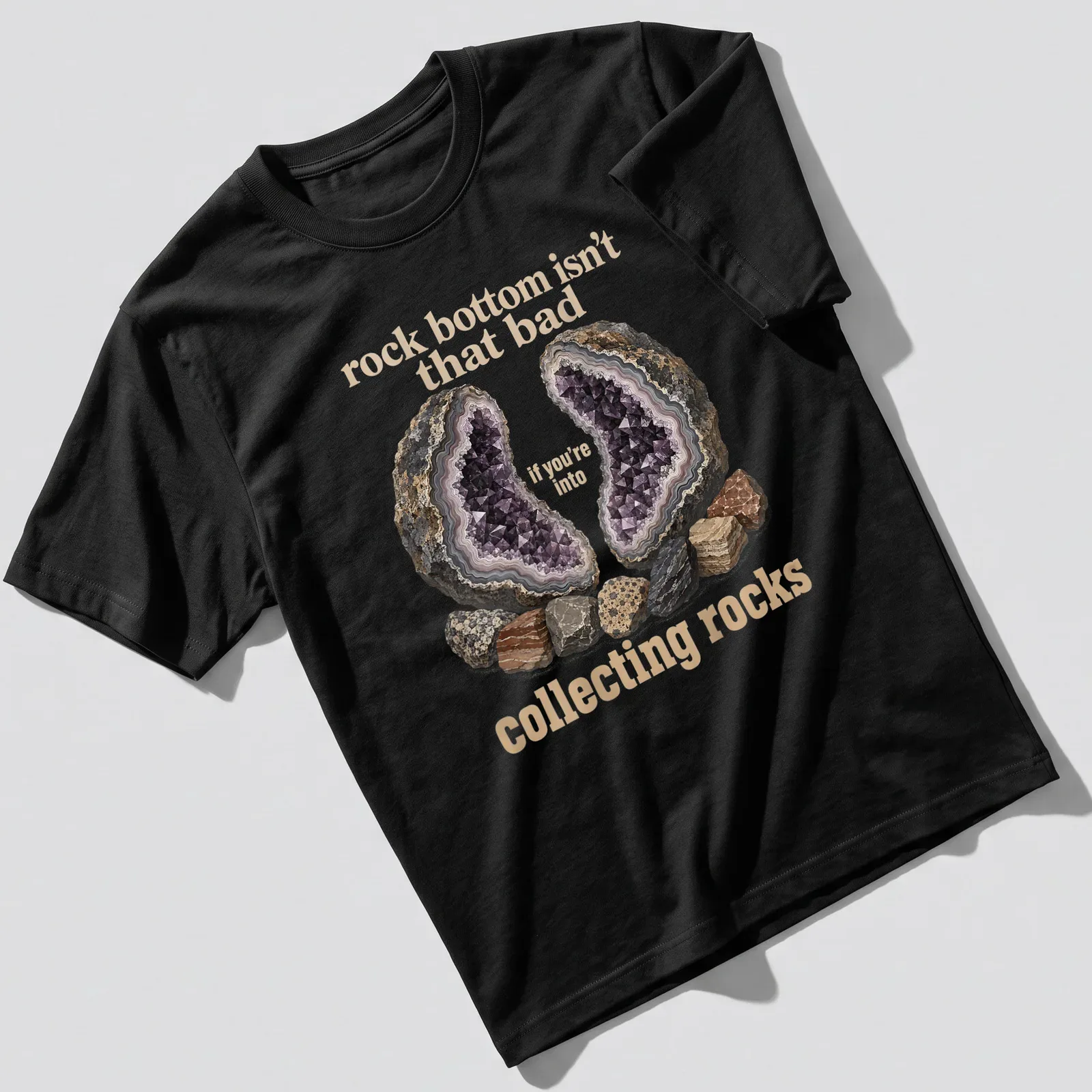 Illustrative design featuring various rocks and a geode with a humorous quote about collecting rocks. — printed on a unisex t-shirt