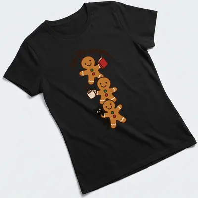 Kawaii style T-shirt with gingerbread cookies and a black cat illustration alongside festive text — printed on a women's shirt