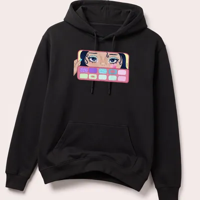 Colorful illustration of a girl applying makeup with eyeshadow palettes — printed on a unisex hoodie