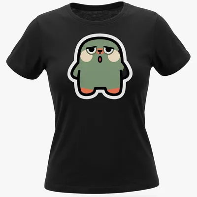 Flat design of a cute green blob monster with peach and black accents — printed on a women's shirt