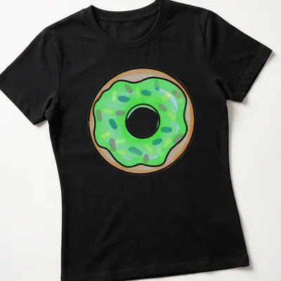 Cartoon donut with green icing and colorful sprinkles design — printed on a women's shirt