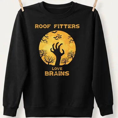 Whimsical zombie hand graphic with text 'Roof Fitters Love Brains' in yellow, white, and black. — printed on a unisex sweatshirt