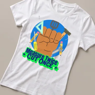 Colorful cartoon design of hand tools with text Measure Twice CUT ONCE — printed on a women's shirt