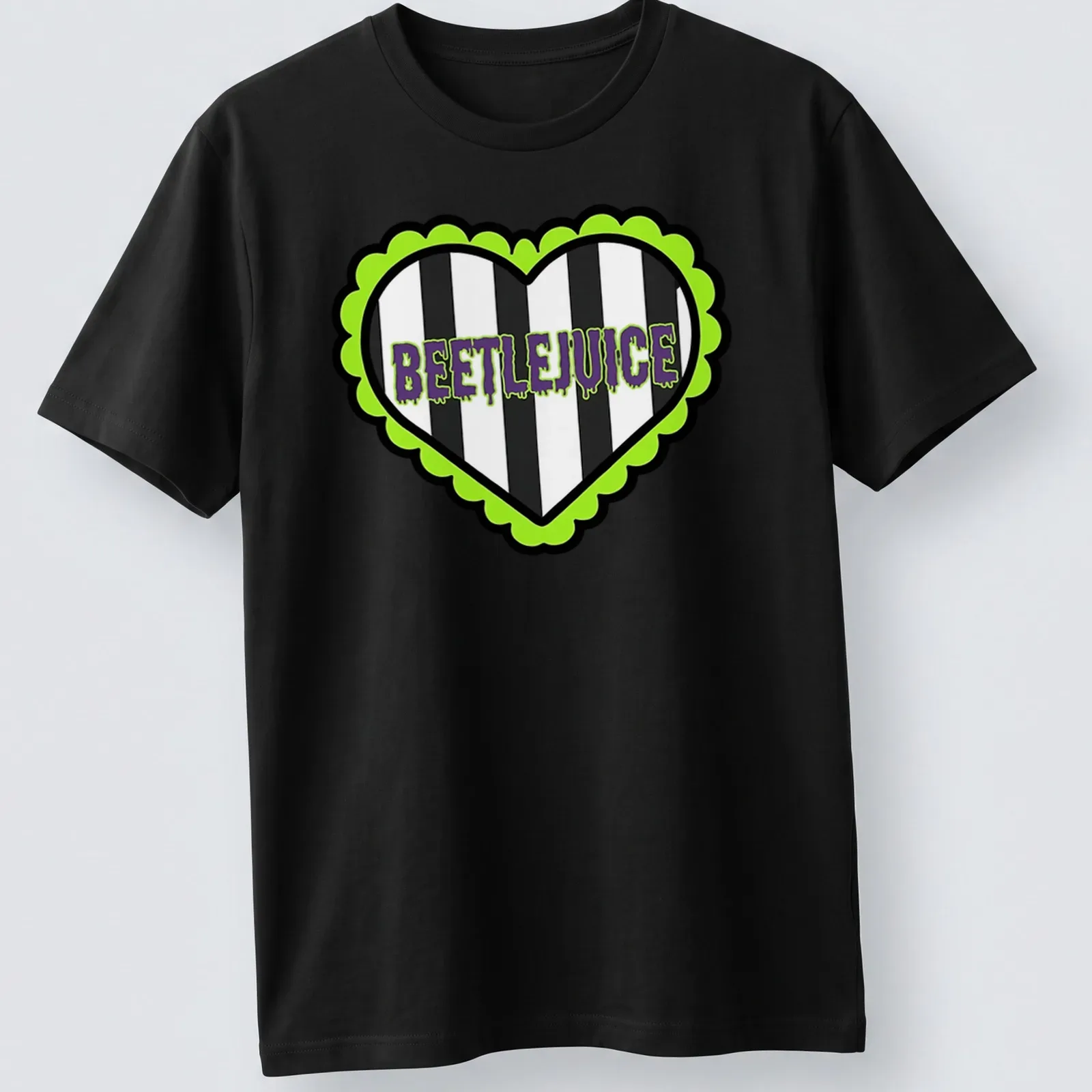 Bold graphic Beetlejuice heart t-shirt with striking lettering in green and purple — printed on a unisex t-shirt
