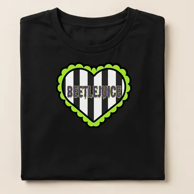 Bold graphic Beetlejuice heart t-shirt with striking lettering in green and purple — printed on a women's shirt