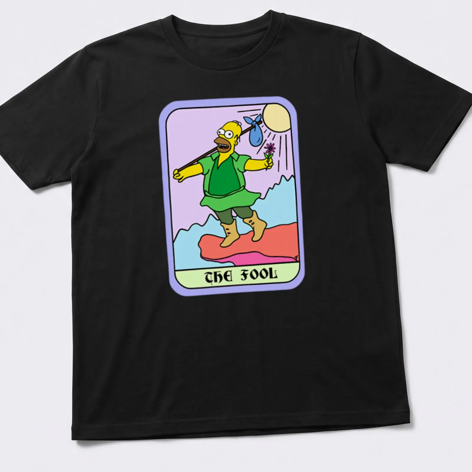Cartoon design of Homer Simpson with text 'THE FOOL' in colorful print — printed on a unisex t-shirt