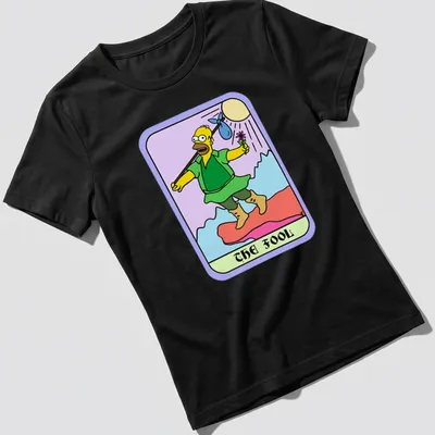 Cartoon design of Homer Simpson with text 'THE FOOL' in colorful print — printed on a women's shirt