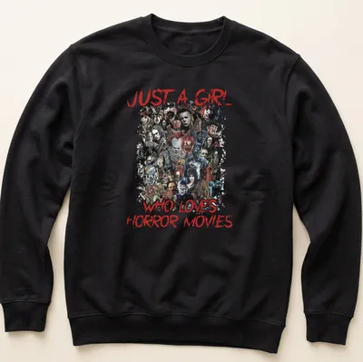 Collage of horror movie characters with text 'Just a Girl Who Loves Horror Movies' — printed on a unisex sweatshirt
