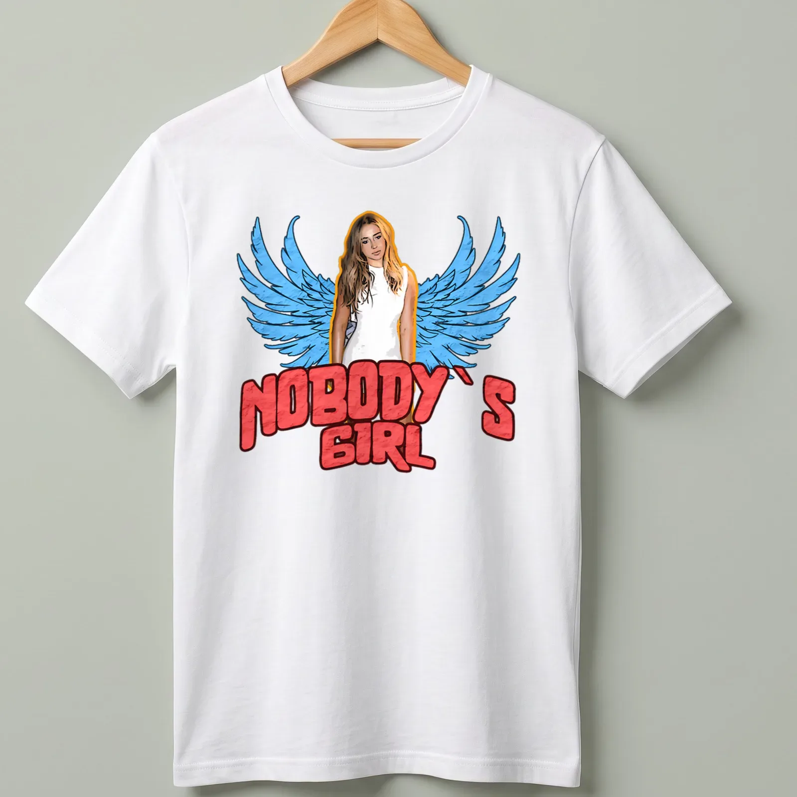 Vintage-style t-shirt featuring a woman with wings and the text 'Nobody's Girl' in bold lettering. — printed on a unisex t-shirt