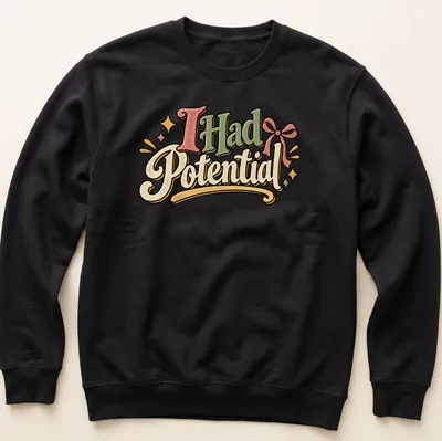 Playful retro t-shirt with the text 'I Had Potential' in green, pink, yellow, and cream. — printed on a unisex sweatshirt