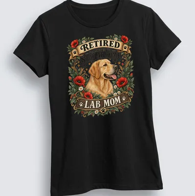 Vintage floral t-shirt with the text RETIRED PROMOTED TO STAY AT HOME LAB MOM and a yellow Labrador illustration — printed on a women's shirt