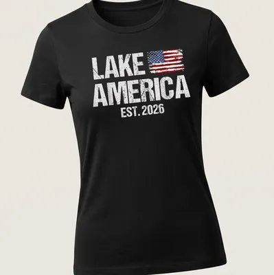 Distressed American flag graphic with 'Lake America Est. 2026' text — printed on a women's shirt