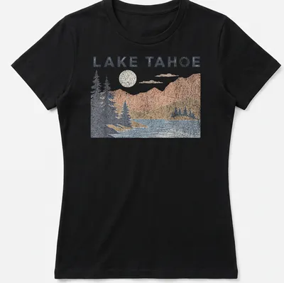 Vintage distressed print of Lake Tahoe mountains and lake scenery with the text 'LAKE TAHOE' — printed on a women's shirt