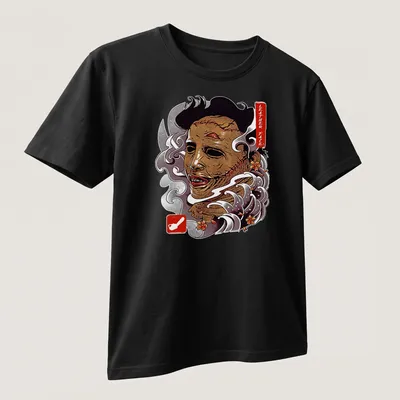 Vintage horror t-shirt featuring Leather Face graphic in brown, white, red, and gray — printed on a unisex t-shirt (angled view)