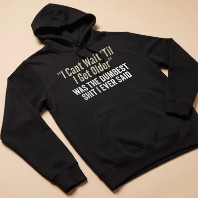 Distressed typography shirt reflecting on youthful optimism with humorous text. — printed on a unisex hoodie