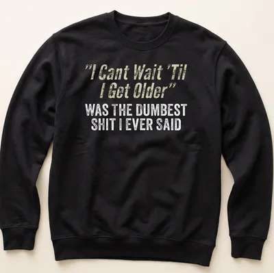 Distressed typography shirt reflecting on youthful optimism with humorous text. — printed on a unisex sweatshirt