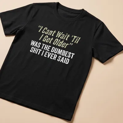 Distressed typography shirt reflecting on youthful optimism with humorous text.