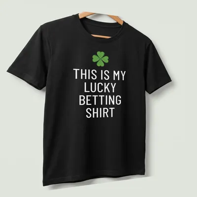 Cartoon style t-shirt with a four-leaf clover and text saying 'This Is My Lucky Betting Shirt' — printed on a unisex t-shirt (angled view)