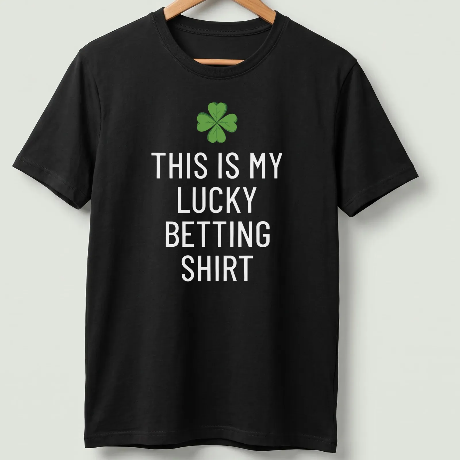 Cartoon style t-shirt with a four-leaf clover and text saying 'This Is My Lucky Betting Shirt' — printed on a unisex t-shirt