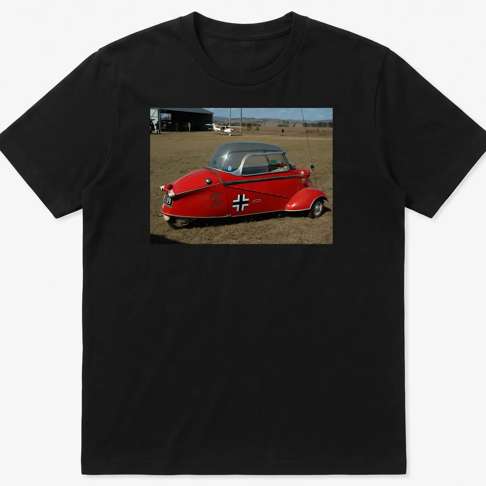 Realistic print of a red microcar with Festival Of Flight text — printed on a unisex t-shirt