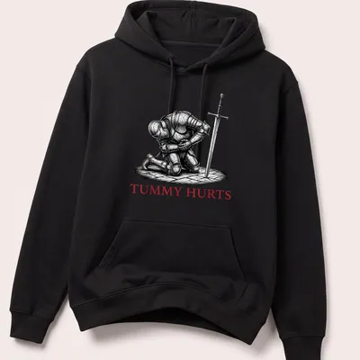 Dark humor T-shirt featuring a Medieval knight with the text 'TUMMY HURTS' in black, white, and red. — printed on a unisex hoodie