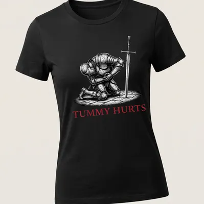 Dark humor T-shirt featuring a Medieval knight with the text 'TUMMY HURTS' in black, white, and red. — printed on a women's shirt