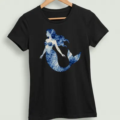 Watercolor design of a mermaid swimming in a blue ocean scene — printed on a women's shirt