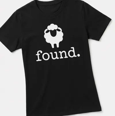 Minimalist black and white sheep icon with the word 'Found.' below. — printed on a women's shirt