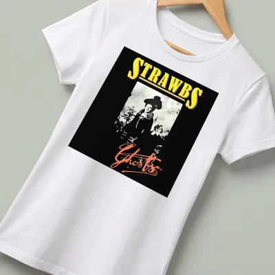 Monochrome print of a woman's portrait with the text 'STRAWBS Ghosts' in black, white, yellow, and red hues. — printed on a women's shirt