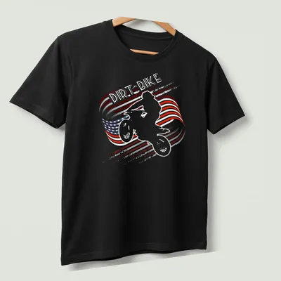 Distressed print of a motocross dirt bike with American flag colors — printed on a unisex t-shirt (angled view)