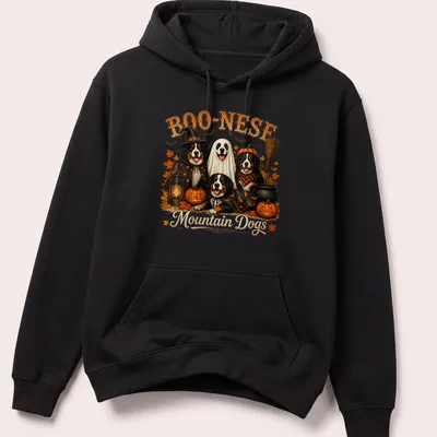 Vintage illustration of mountain dogs with pumpkins and Halloween themes — printed on a unisex hoodie