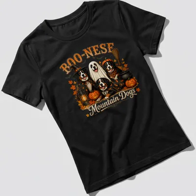 Vintage illustration of mountain dogs with pumpkins and Halloween themes — printed on a women's shirt