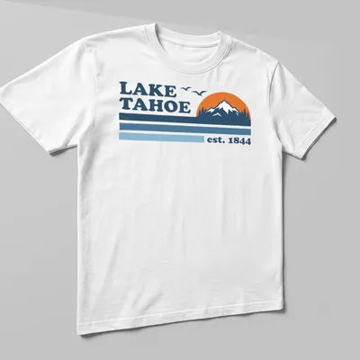 Retro graphic featuring Lake Tahoe est. 1844 in blue and orange — printed on a unisex t-shirt (angled view)