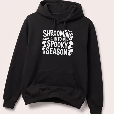 Playful cartoon design of mushrooms for spooky season with vibrant colors — printed on a unisex hoodie