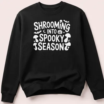 Playful cartoon design of mushrooms for spooky season with vibrant colors — printed on a unisex sweatshirt